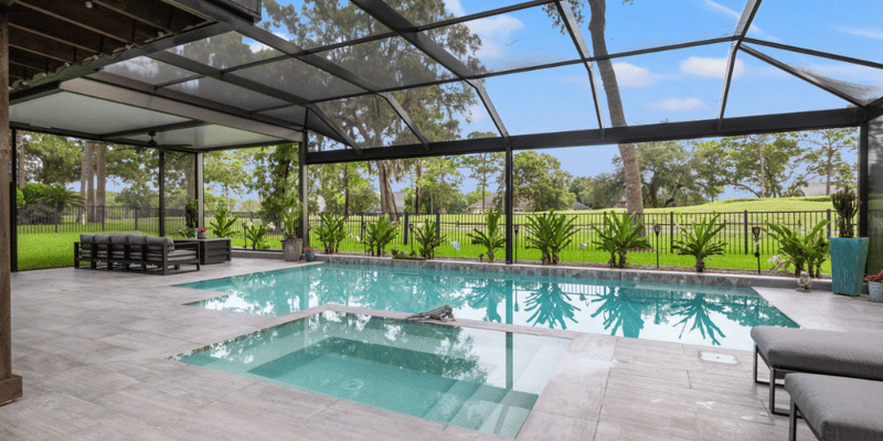Outdoor Pool Enclosure with Beautiful Pool and Hot Tub