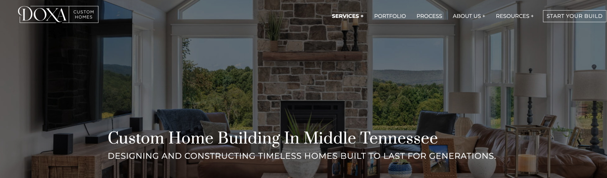 custom-home-building-middle-tennessee-service-page-hero-stone-fireplace-and-large-windows-doxa-custom-homes