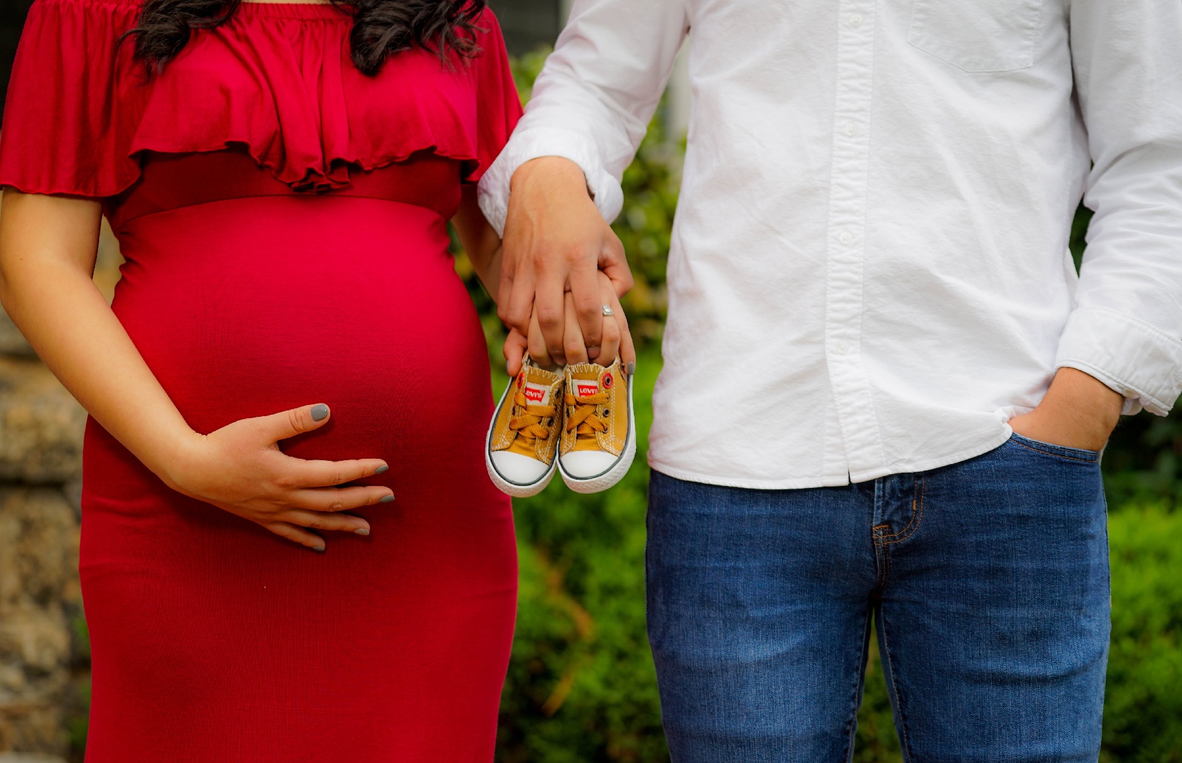 Pregnant couple designing a custom home for their new needs