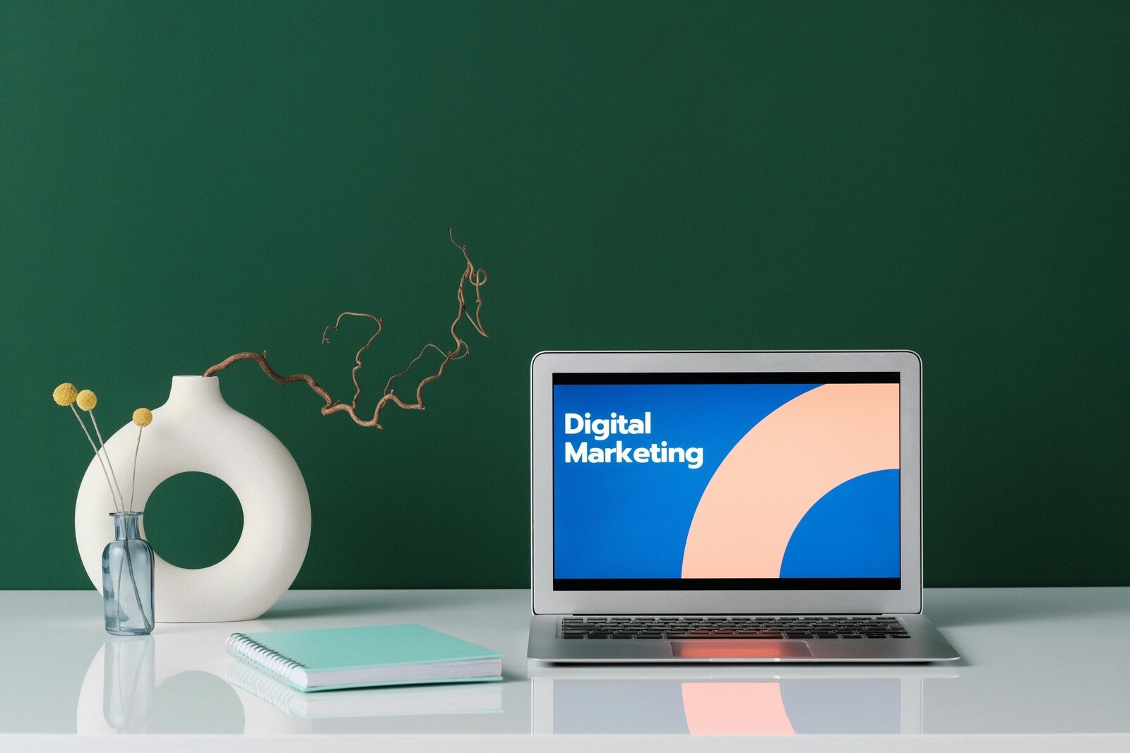 laptop displaying a bold and colorful -Digital Marketing- design on a desk with minimalist decor, highlighting branding and strategy planning for remodelers. Builder Funnel.jpg