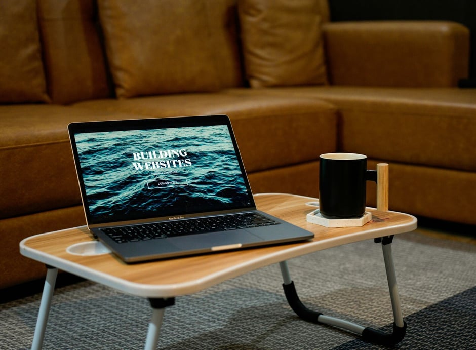 laptop-on-coffee-table-with-contractor-website-landing-page-text
