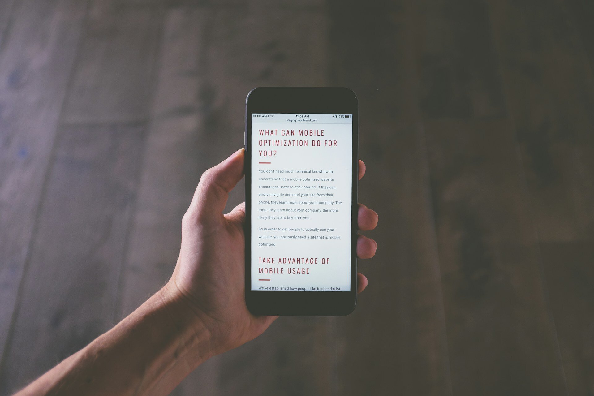 man-holding-phone-mobile-optimization-website-marketing-plan