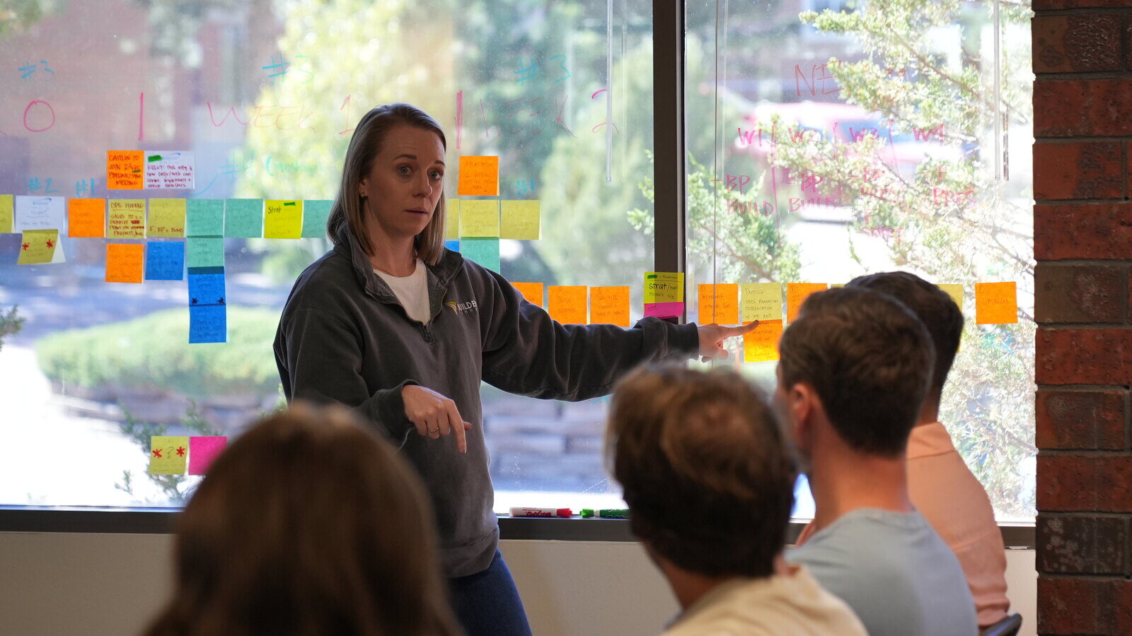 marketing-team-leader-presenting-digital-strategy-plan-at-local-agency