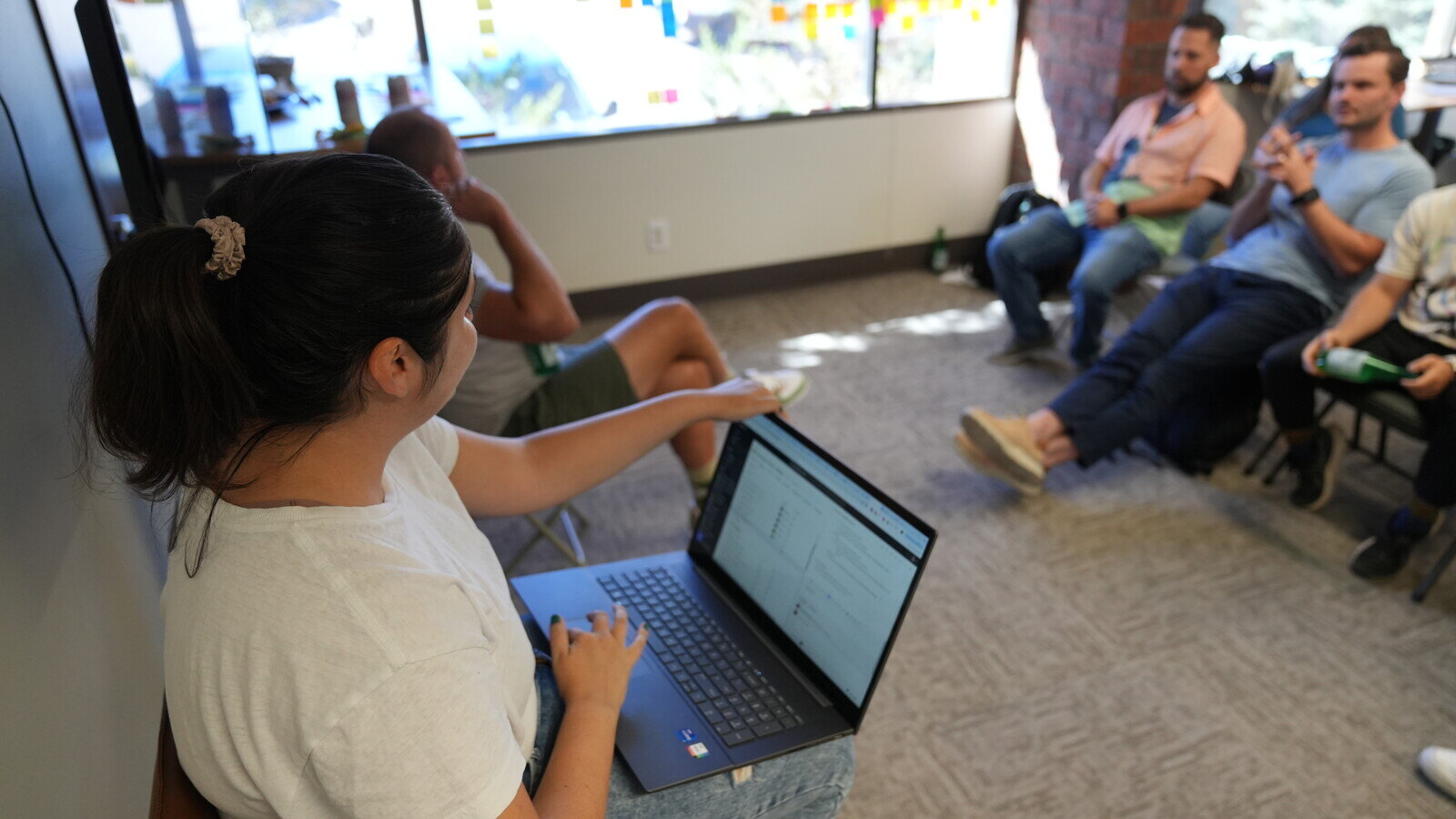 team-member-sharing-analytics-on-laptop-at-local-digital-marketing-agency